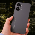 Hand holding the Poco X8 Pro Max showing its rear camera module